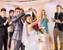 Bride & groom having fun with their guests dancing.